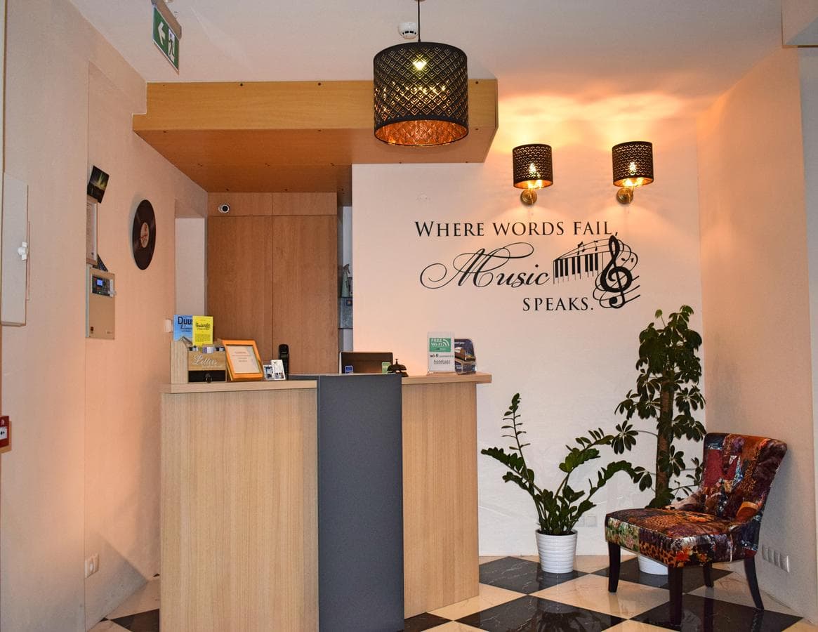 Reception desk under the words Where words fail, music speaks